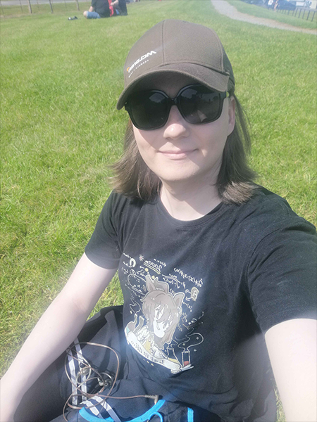 Me at Oulton Park for British GT, in a skirt and tights